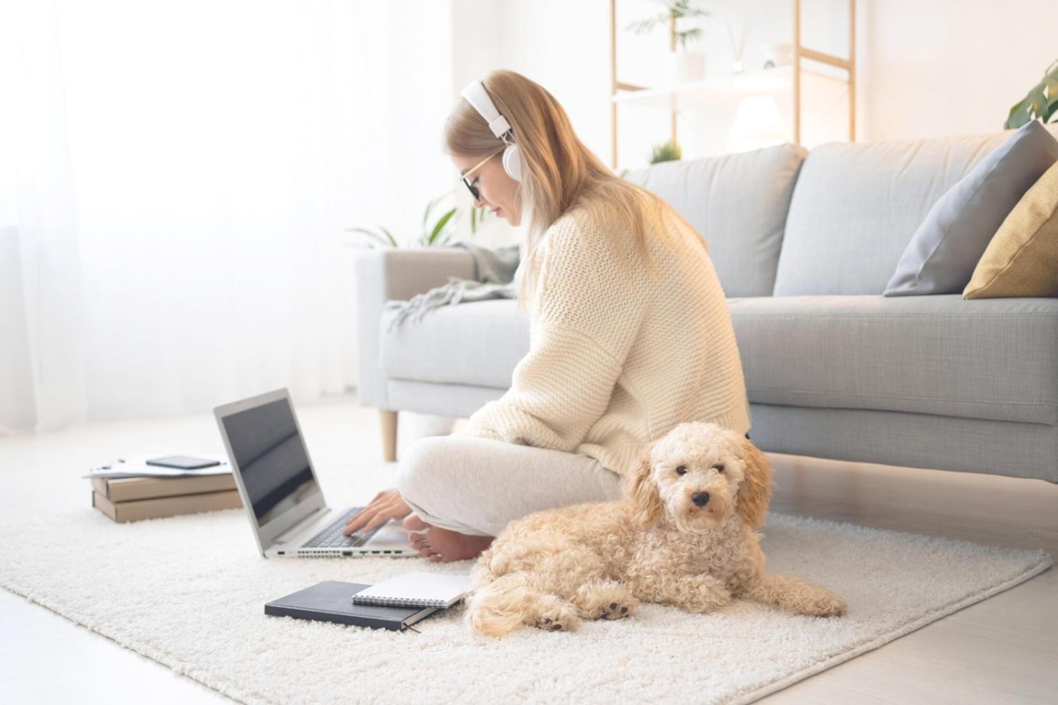 Student reviewing budget spreadsheet with calculator and coffee